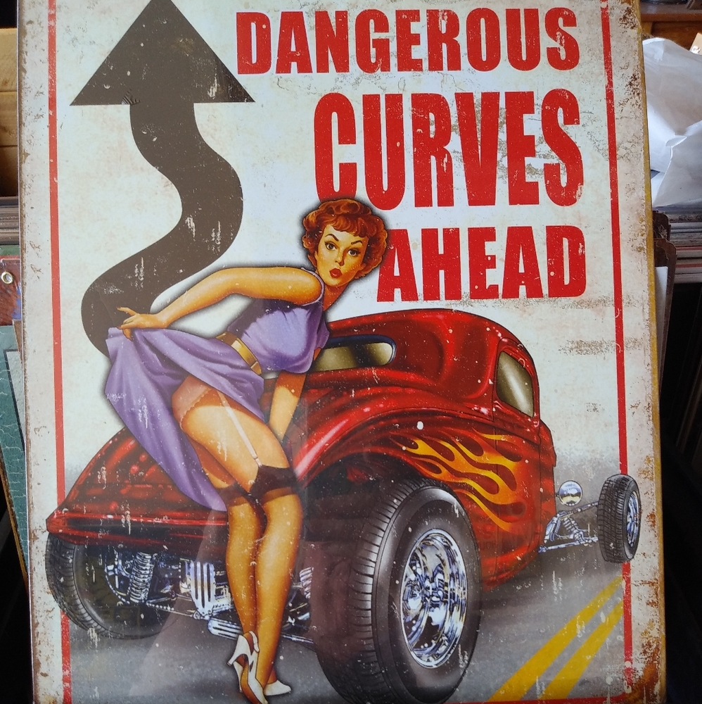 Dangerous Curves Ahead metal sign